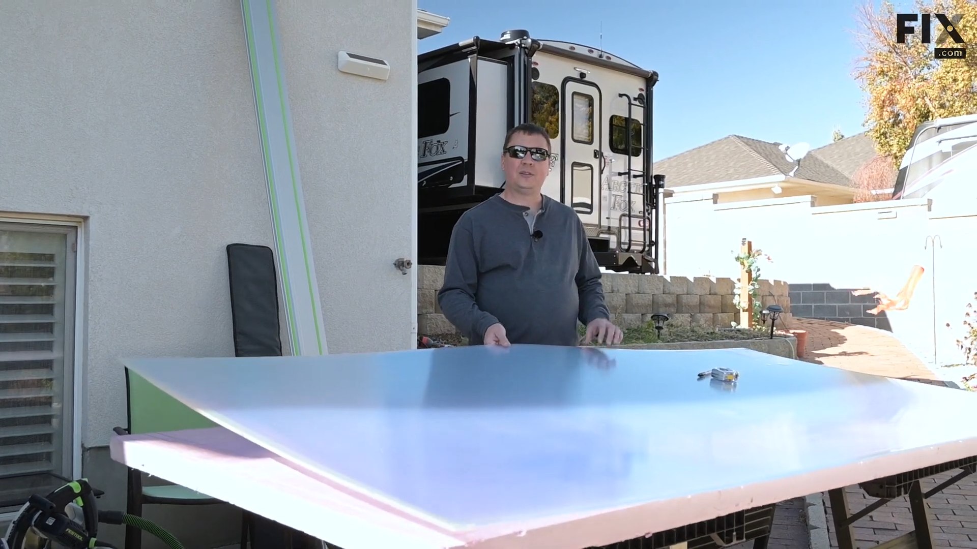Expert technician holding up a single sheet of double-wall-carbonate